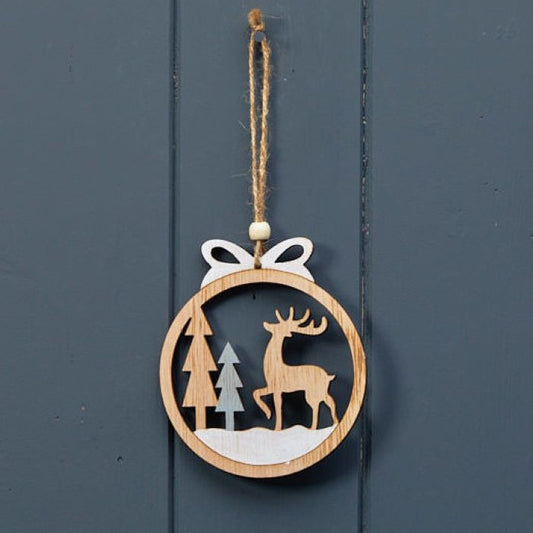 Wooden Hanging Christmas Bauble With a Reindeer In a Forest